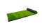Roll with artificial green lawn isolated on white background, covering for playgrounds and sports grounds