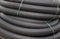 Roll of black flexible conduit nylon pipe background