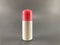 Roll-on bottle, white, pink lid, placed on a gray background