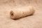 A roll or coil of natural rope or jute twine on burlap or rustic fabric