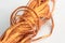 A roll of copper wire on white background.