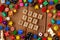 `Roll the Dice` spelled out in wooden letter tiles