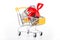 Roll of dollars bill banknotes with red ribbon in supermarket trolley cart consumer basket as unconditional income or gift