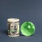 Roll of dollars and green planet earth globe. International money transfers, attraction of investments. Global financial system.