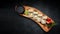 Roll Ebi Ringo with tiger shrimp, cream cheese, apple and tobiko, on a wooden board, on a dark background