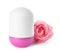 Roll-on female deodorant with pink rose on white background.