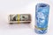 Roll of money on isolated white background, banknotes of 100 reais from brazil with american hundred dollar bills, spot focus