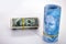 Roll of money on isolated white background, banknotes of 100 reais from brazil in front and unfocused, with american hundred