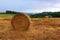 Roll mown hay on the background of the hills of Tuscany