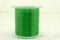 Roll of nylon fishing line in color background