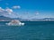 A roll-on / roll-off car ferry loaded with passengers travels between Miyajimaguchi Station and Miyajima Island in Hiroshima Bay.