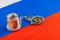 roll of russian paper rubles currency and bitcoin shiner chained with handcuffs on russian flag background