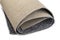 Roll of thin carpet on a white background. Grey polyester texture