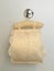 Roll tissue cloth lace fabric cover with toilet paper roll for sanitary inside hanging on white background bathroom