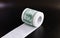 Roll of toilet paper in form of dollars, concept of deficit and inflation