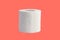 Roll of toilet paper isolated on coral background