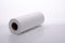 Roll of white cotton napkins on white background, insulated