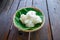 Roll white thai rice noodle on the banana leaf in the bamboo basket. Thai food (Thai language Kanom jeen)