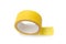 Roll of yellow masking tape on white background