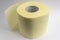 Roll of yellow textured embossed toilet paper on a white background