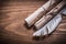 Rolled aged paper feather on wood board top view