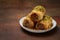 Rolled baklawa, home made traditional dessert, baqlawa, baqlava, baklava on dark surface, selective focus. Ramadan iftar food