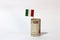 Rolled banknote money one thousand Lire Italy and stick with mini Italia nation flag on white background