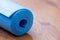 Rolled blue yoga mat