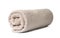 Rolled clean beige towel on white