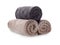 Rolled clean soft towels on white background