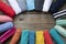 Rolled colorful clothes set in circle shape on woode