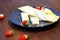 Rolled Crepes with strawberries on white plate on wooden background