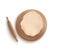 Rolled dough piece in round shape lying on wooden cutting board with rolling pin