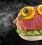 Rolled fresh ham meat in tied - veal roulade. Raw rolled meat enclosed in net netting with spices - ready to barbecue-bbq and clip