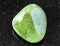 rolled Grossular (green garnet) rock on black