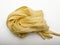 A rolled handful of pasta for raw noodles