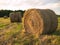 Rolled hay bales at sunset 2
