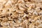 Rolled oats background. Organic oatmeal background texture