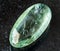 rolled Prasiolite (green quartz) rock on black