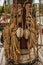 Rolled rope and pulleys supported on the central mast of a sailing ship on a cloudy day in Amsterdam.