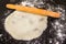 Rolled round dough for tortillas with rolling pin