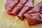 Rolled slices of bresaola, delicious typical italian raw beef salami, close up