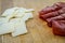 Rolled slices of bresaola, delicious typical italian raw beef salami, with grana padano cheese flakes