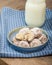 Rolled and sugared cookies with milk