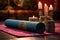 rolled-up yoga mat with meditation cushions and incense