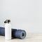 Rolled yoga mat and metal water bottle