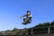 Roller boy jumping from parapet