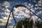 Roller coaster loop with a background of beautiful cloudy sky