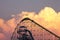 Roller coaster at Valley Fair theme park silhouetted against dramatic clouds