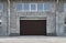 Roller garage doors or sliding gates, construction or renovation of a garage or industrial building